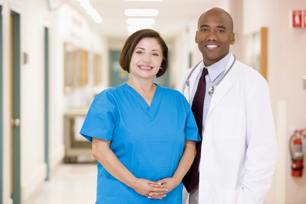 doctor and nurse standing in a hospital corridor